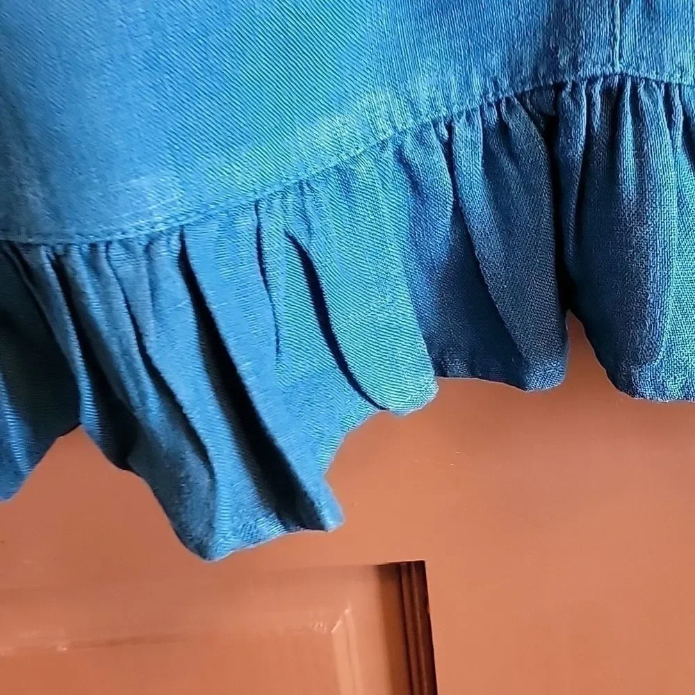 Mosaic-Linen teal buttoned down front, ruffled bottom, long sleeved jkt. Size M.